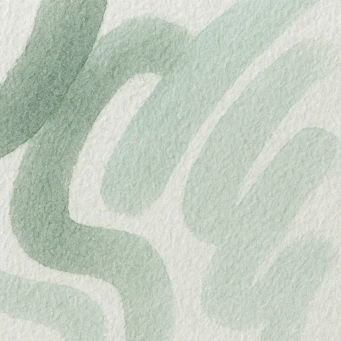 A section of watercolor lettering is left to air dry completely.