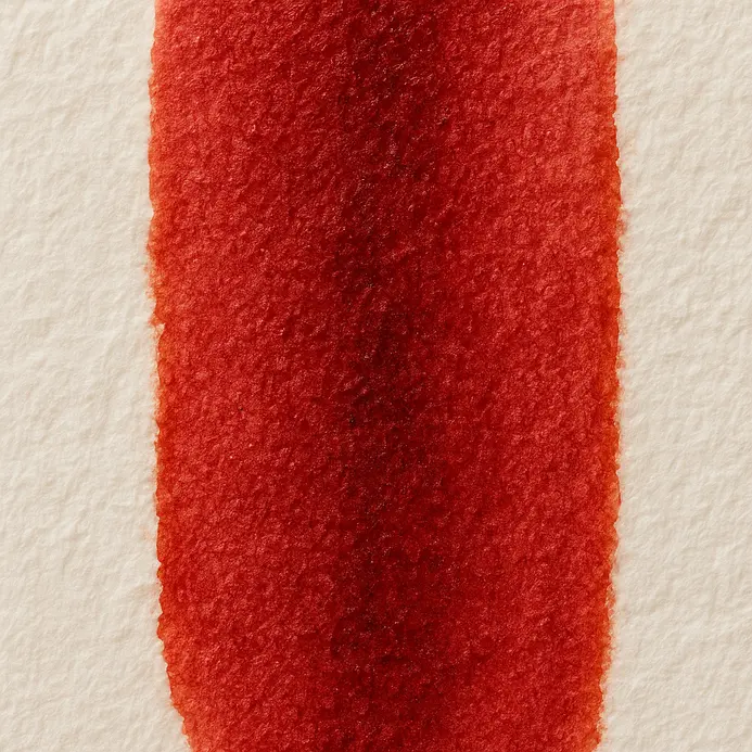 A brush applies firm pressure for a saturated, wide downstroke in watercolor lettering.