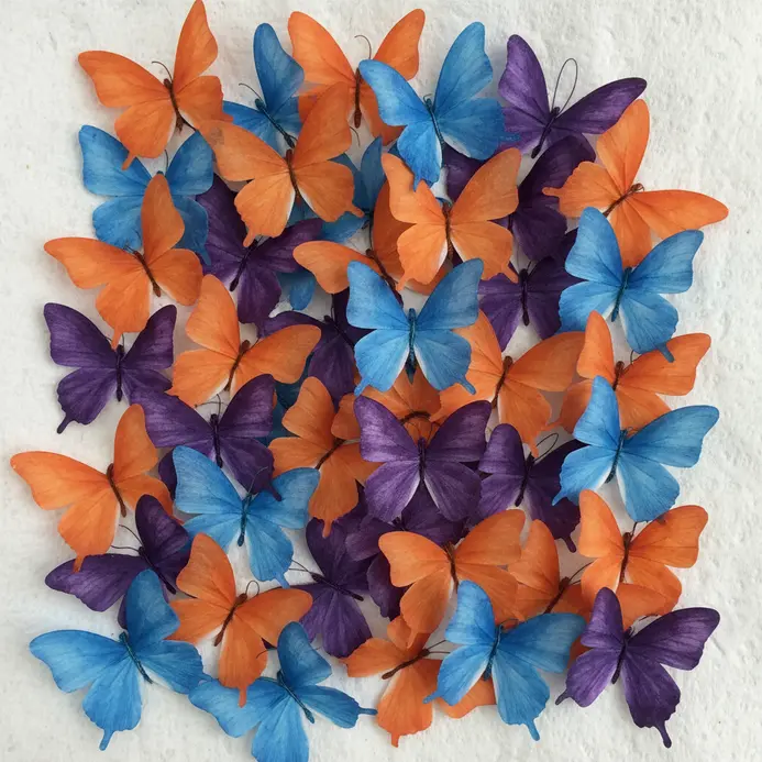 Coffee filters colored with markers, pinched in the middle with a pipe cleaner to form butterflies.