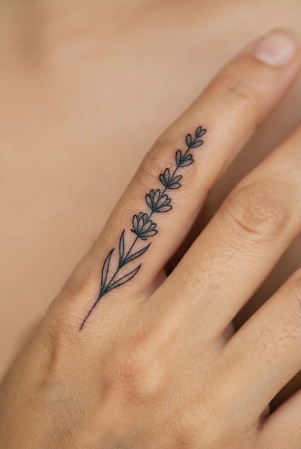 A delicate lavender stem runs along one finger with a narrow stalk and small paired buds in black ink.