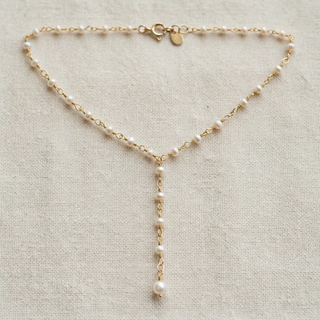 Dainty pearl Y chain necklace with small white pearls and a long central drop, a refined handmade necklace idea.