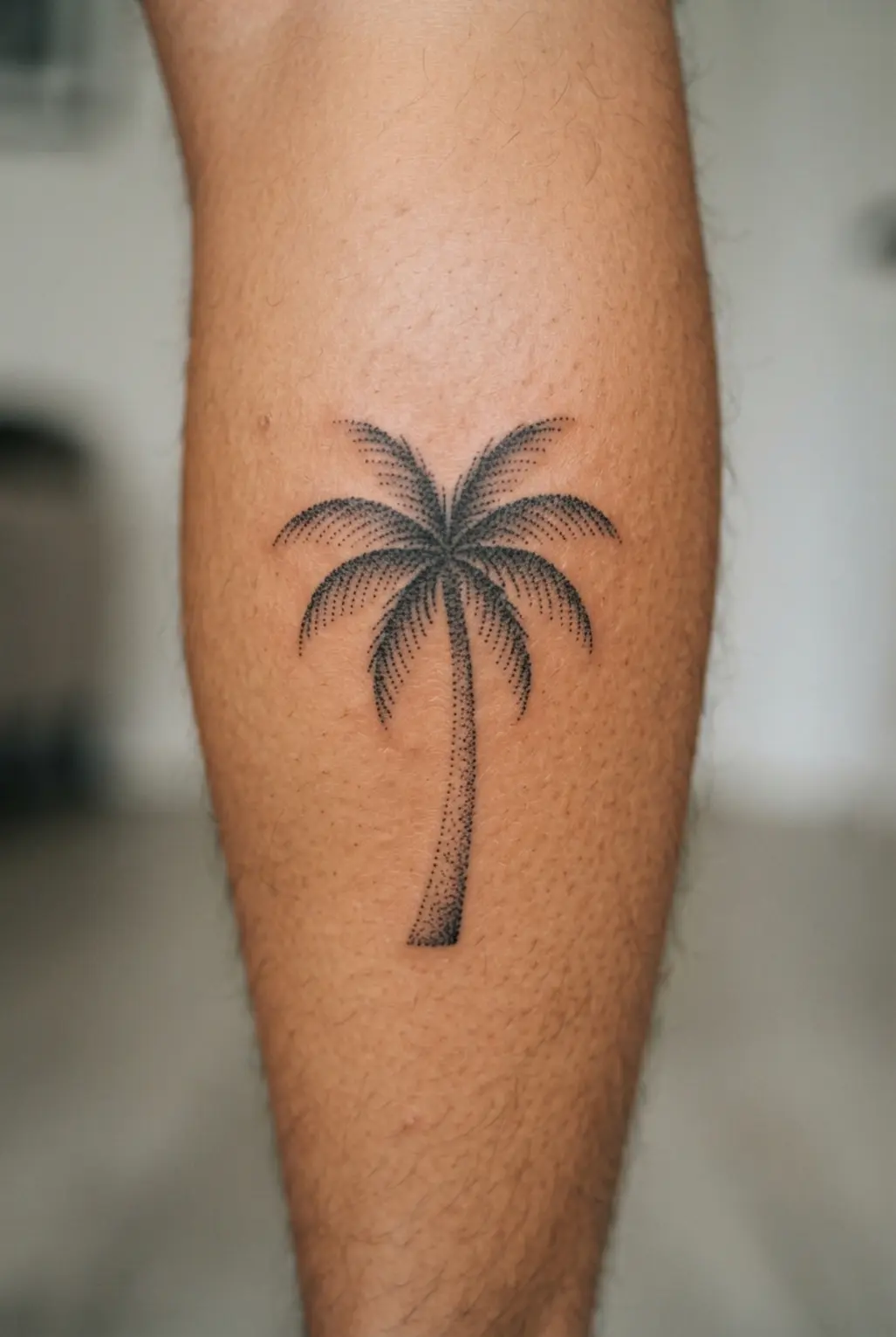 A black palm tree on the calf uses sparse dotted shading beneath the fronds and trunk.