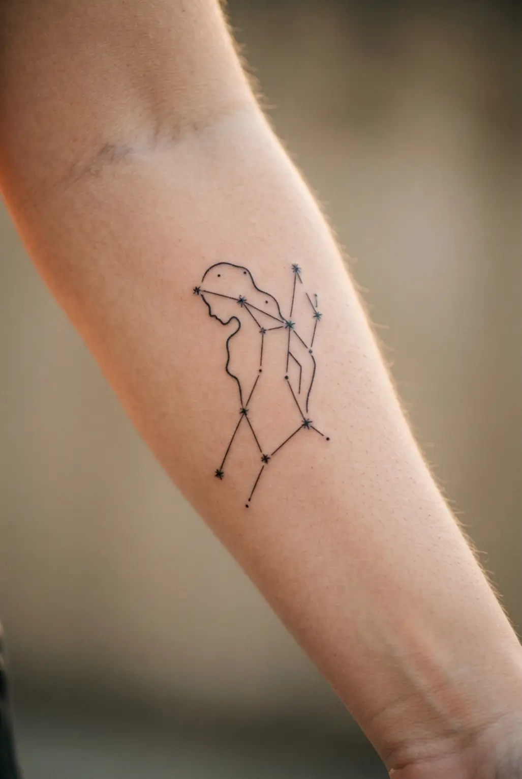 A creative zodiac tattoo where the stars of Virgo form the outline of a maiden's profile.