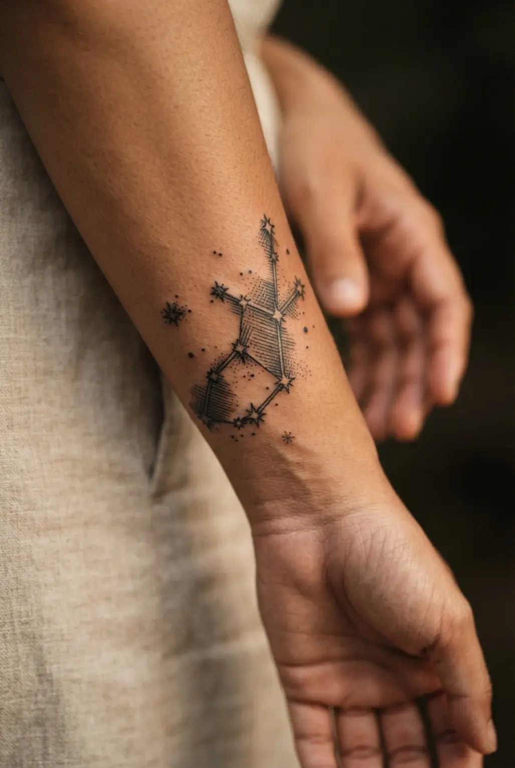 An antique-style tattoo rendering the Virgo constellation with etched, woodcut detailing.