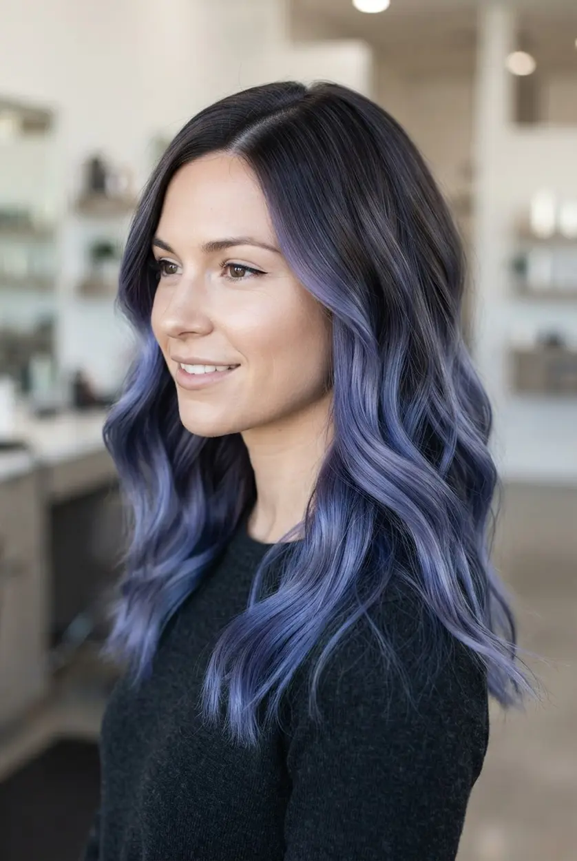 Cool-toned brunette side-part waves with blue-violet balayage painted through the lengths and ends.