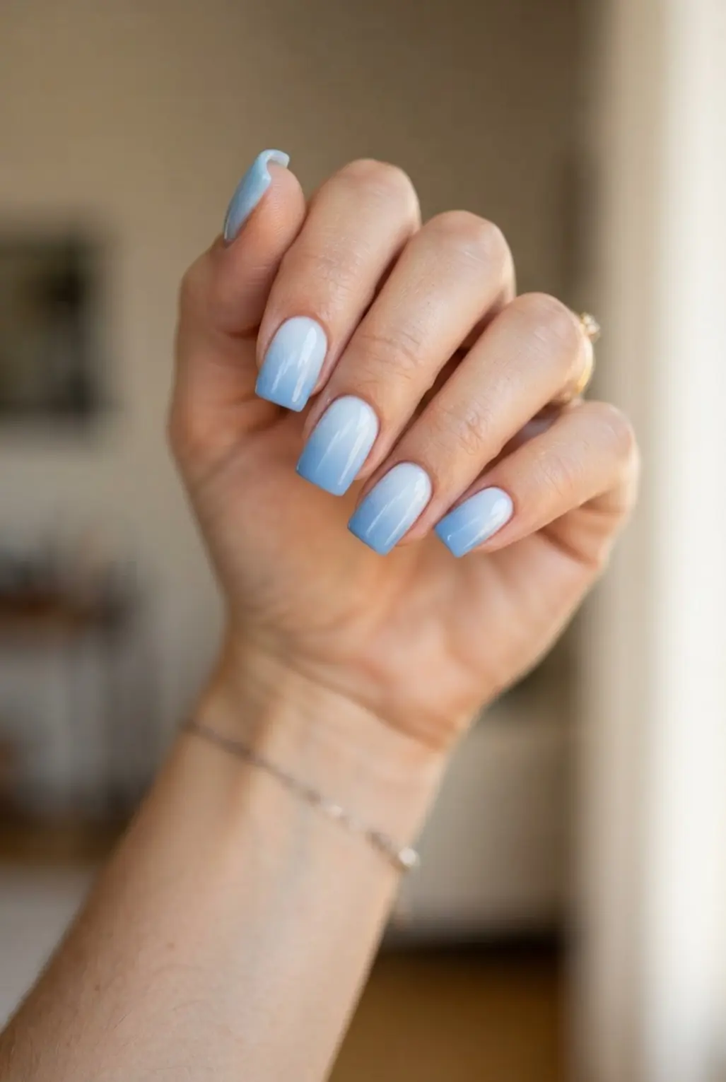 Soft blue ombre square nails with a smooth pale-to-blue gradient.